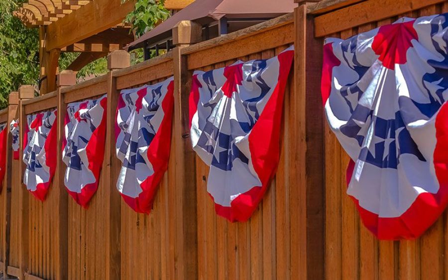 Flags on fence for independence day